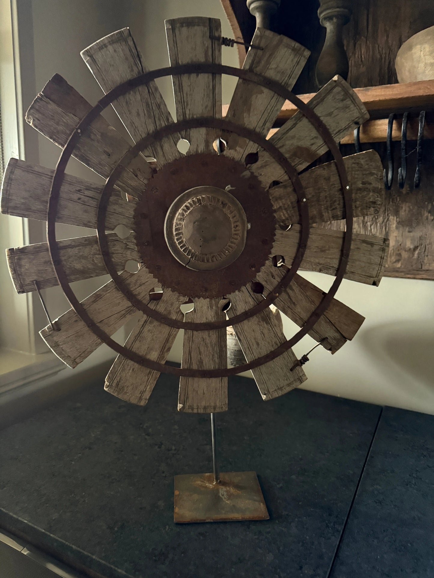 Wooden wheel on metal base
