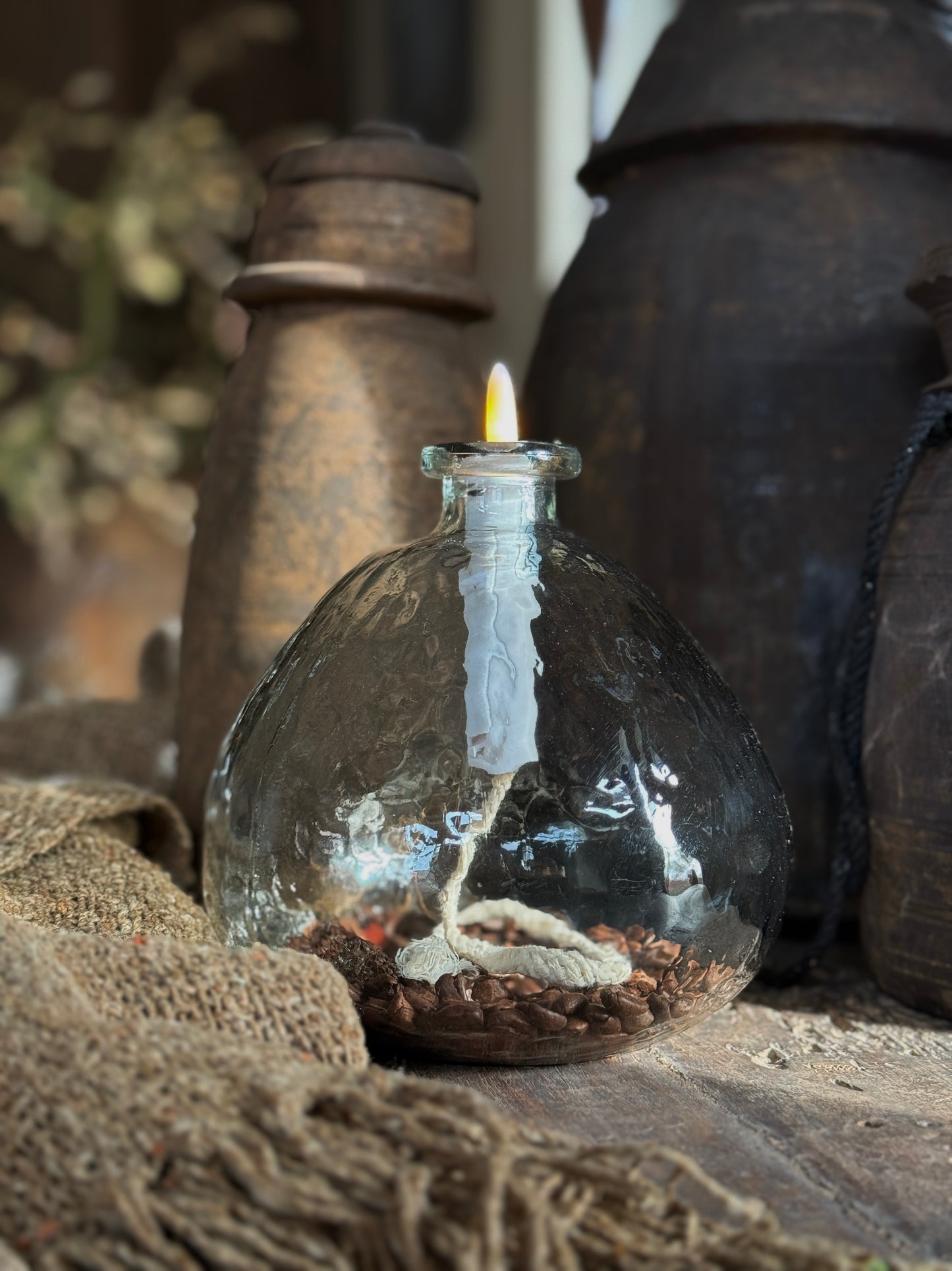 Glass teardrop lamp with LED candle, clear glass