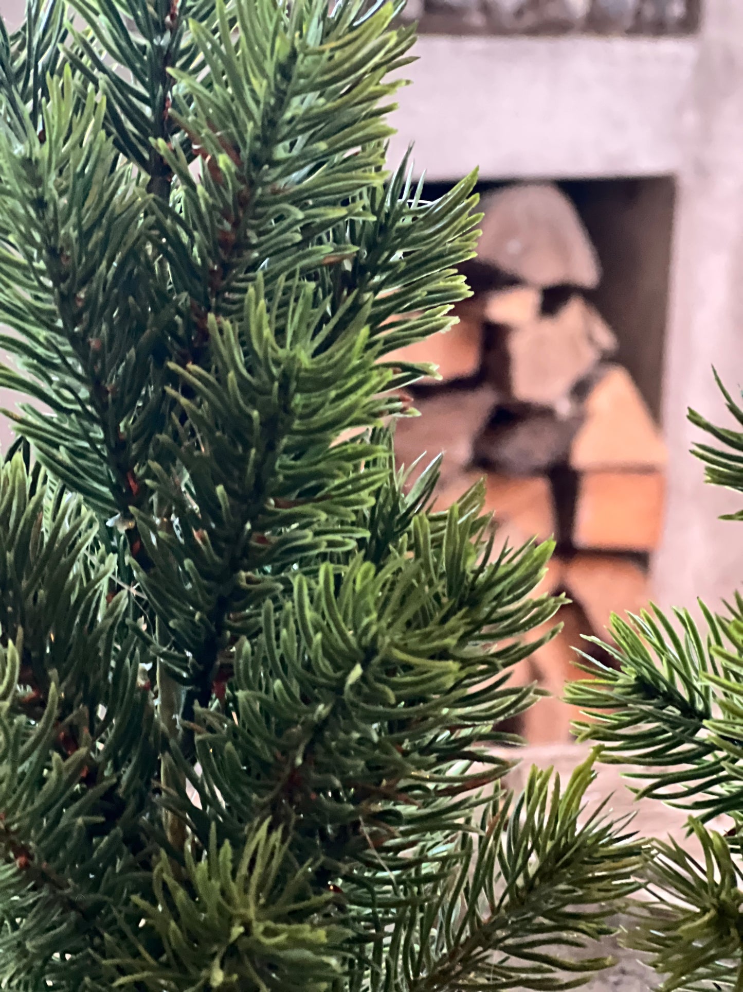 Artificial Christmas tree in plastic pot available in 2 sizes