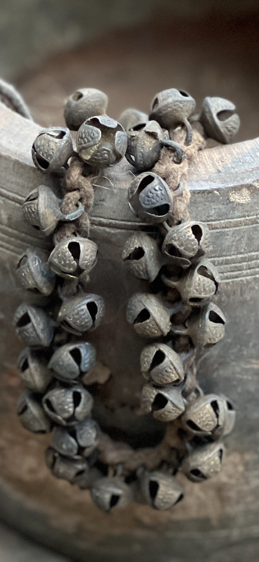 Necklace with metal bells.