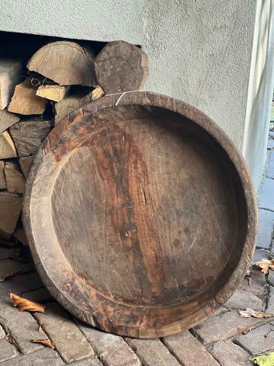 Old wooden bowl with handle