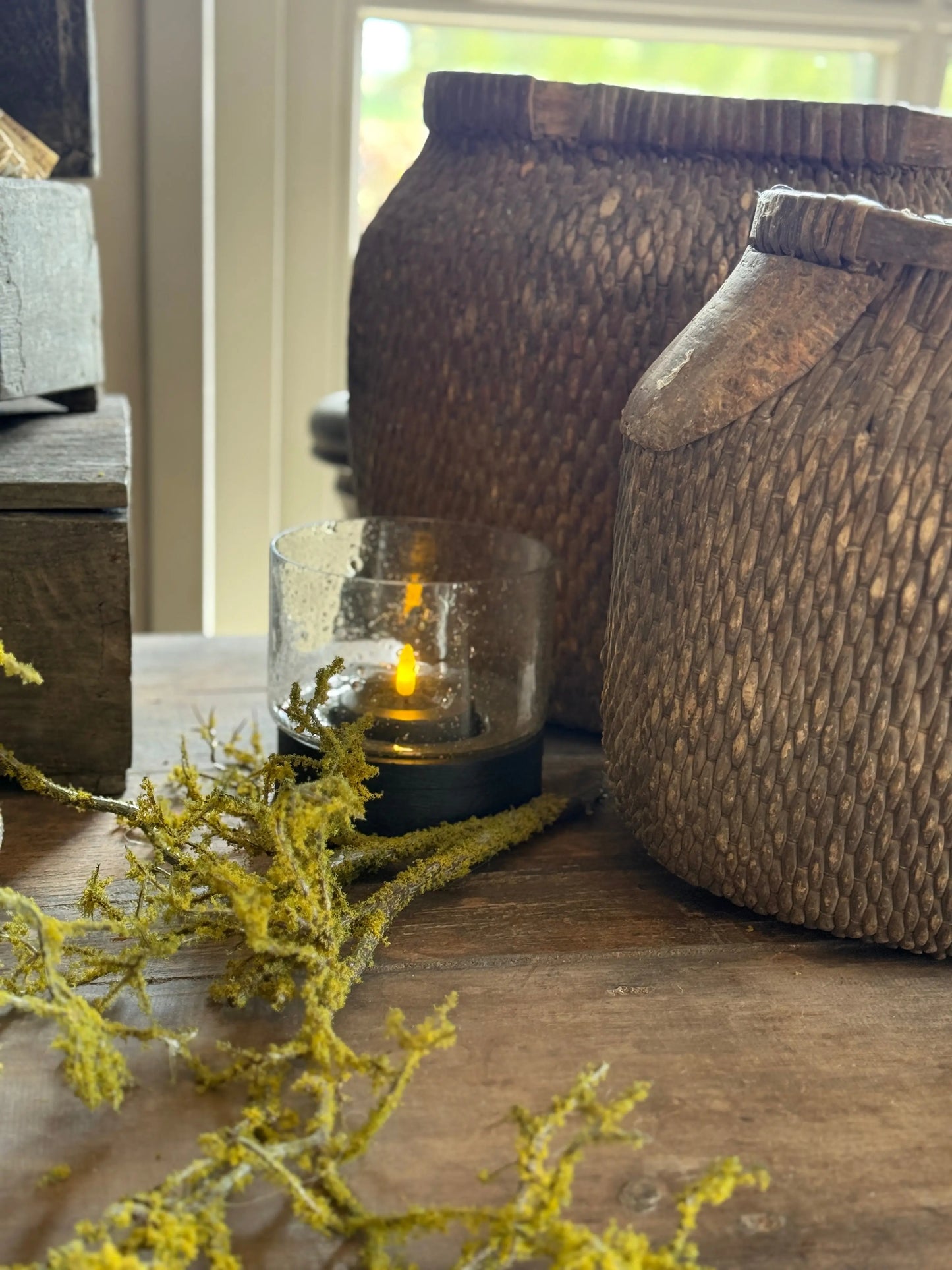 Hurricane lamp with black wooden base and bubble glass