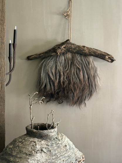 Felted sheepskin wall hanging on stick (LH08)