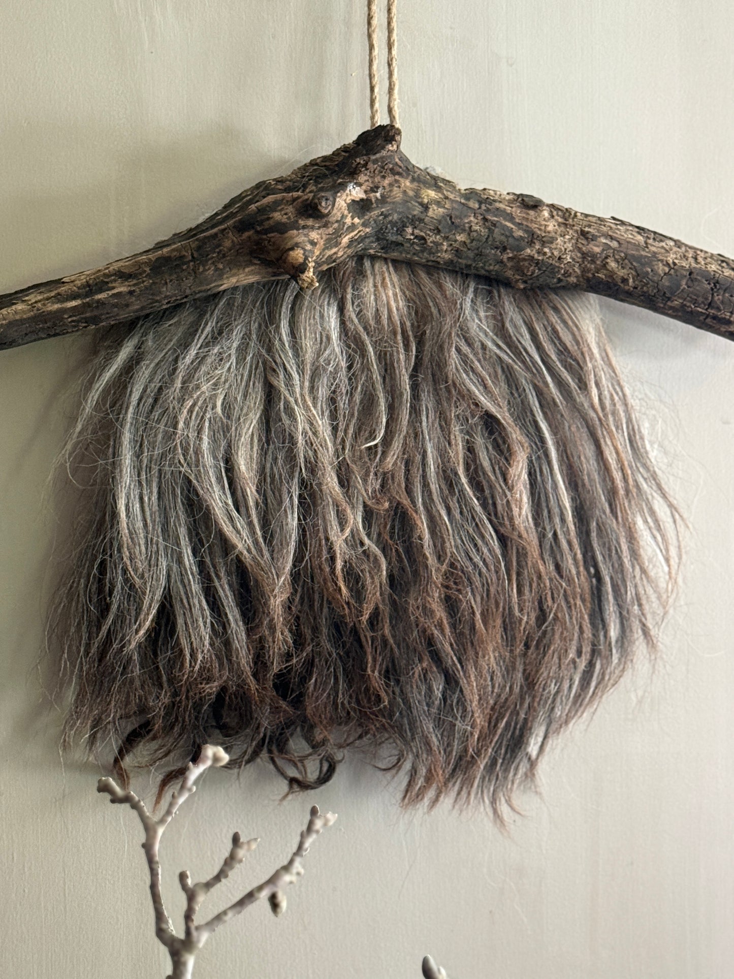 Felted sheepskin wall hanging on stick (LH08)