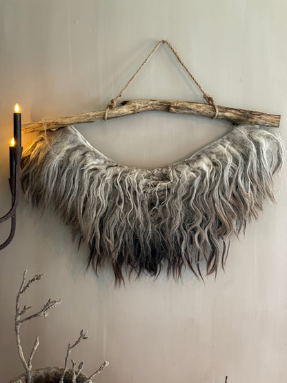 Felted sheepskin wall collar on a stick (LH05)