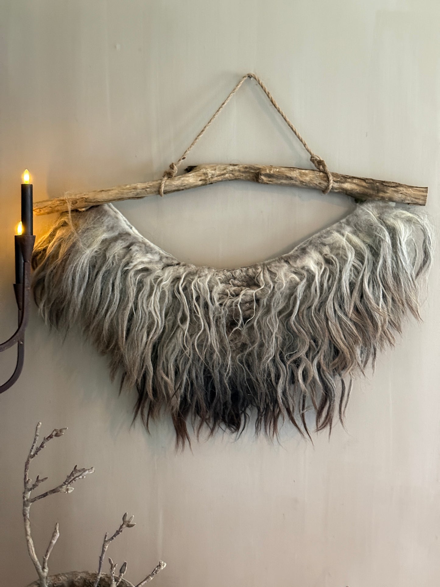Felted sheepskin wall collar on a stick (LH05)