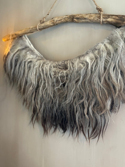 Felted sheepskin wall collar on a stick (LH05)