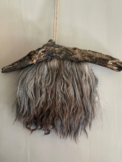 Felted sheepskin wall hanging on stick (LH08)