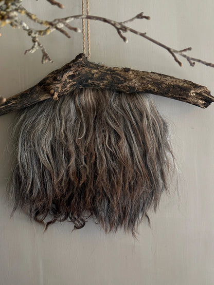 Felted sheepskin wall hanging on stick (LH08)