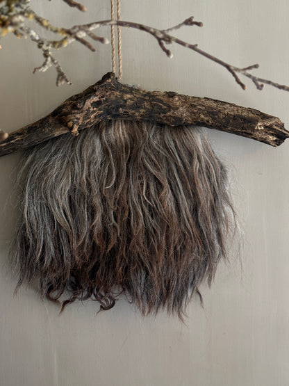 Felted sheepskin wall hanging on stick (LH08)
