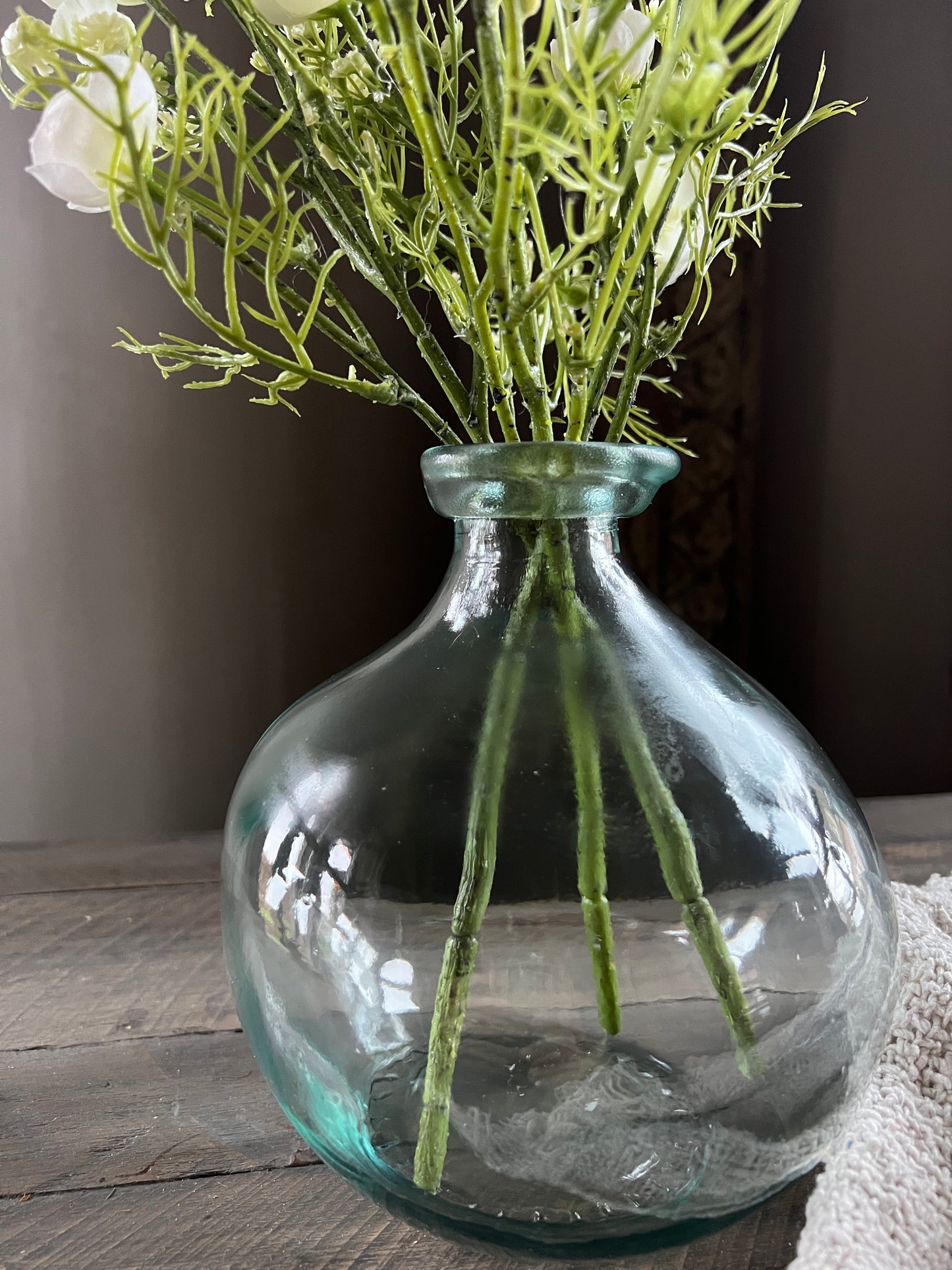 Clear glass vase with narrow opening