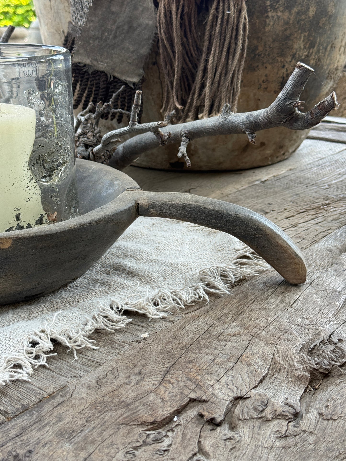 Weathered wooden bowl with a handle. (LH002)