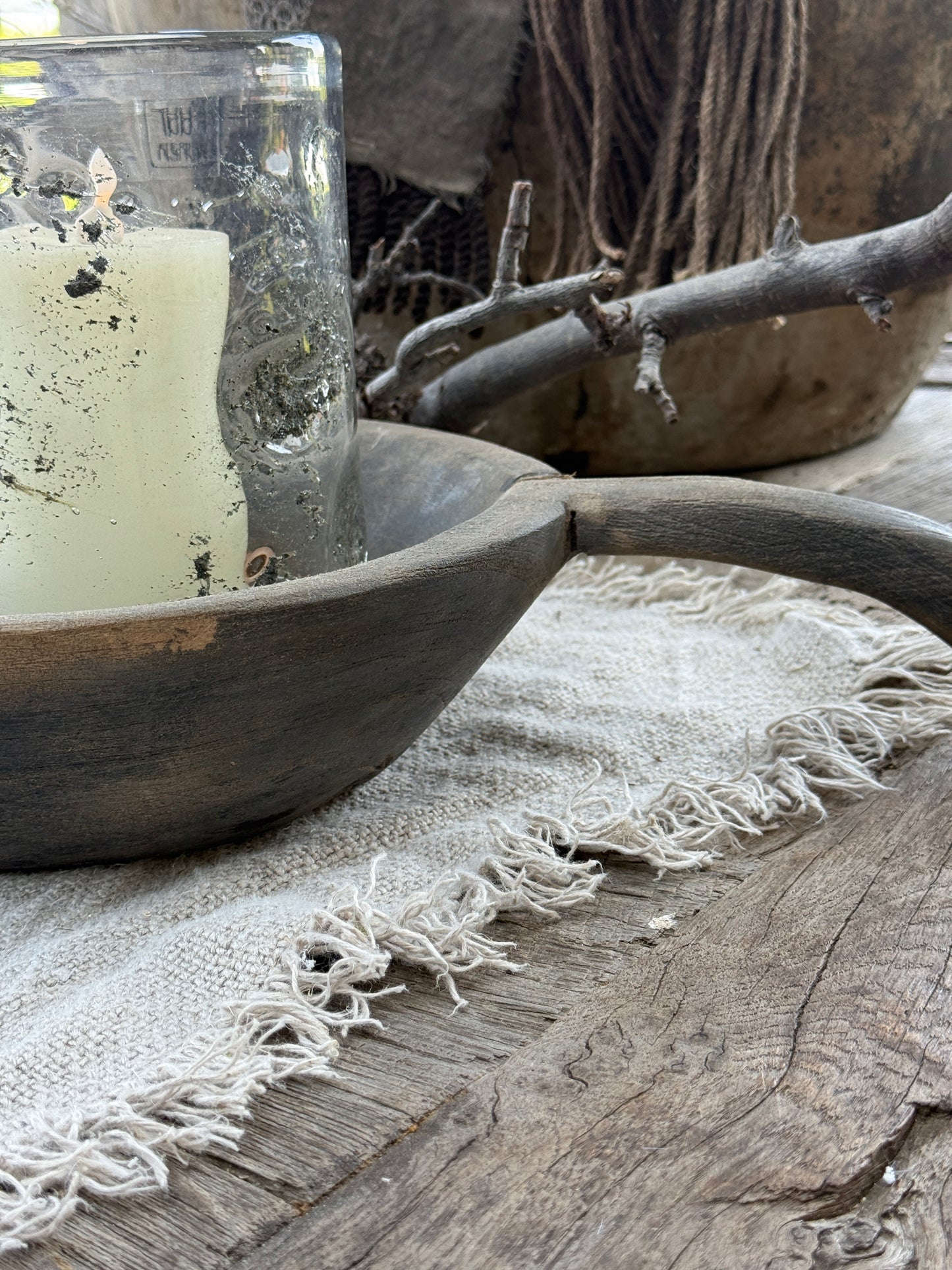Weathered wooden bowl with a handle. (LH002)