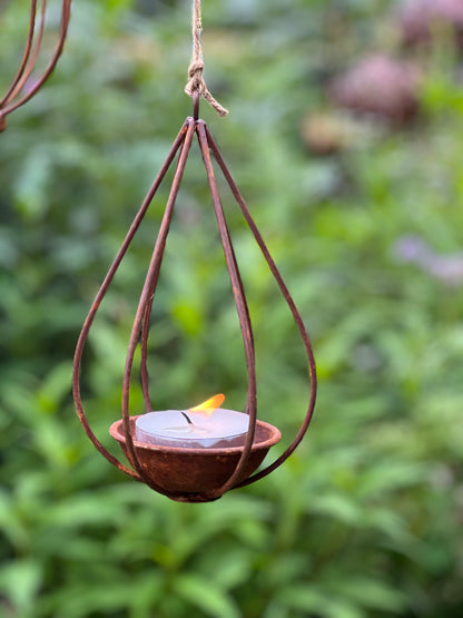 Rusted tea light holder, bulb, drop and lantern
