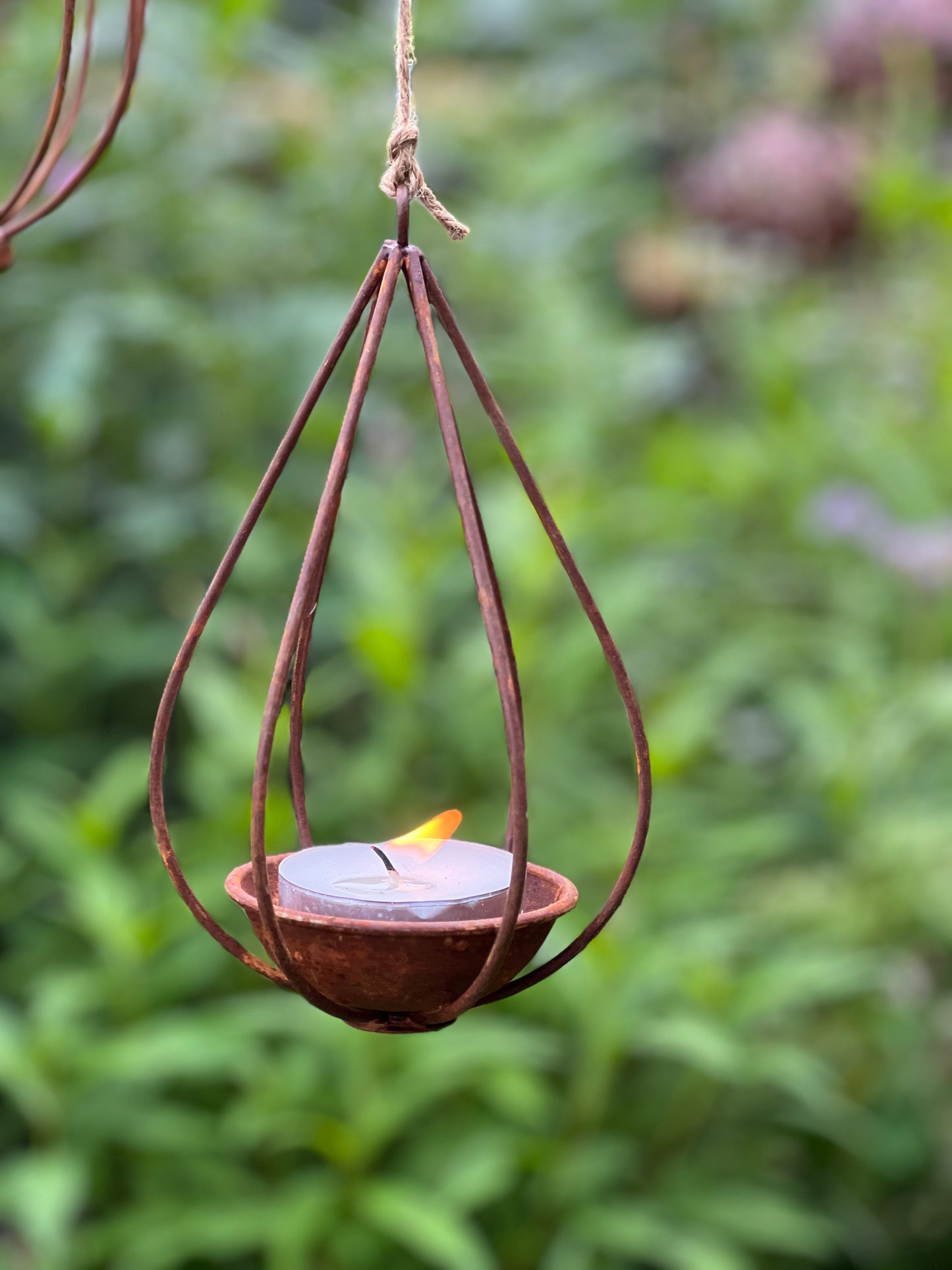 Rusted tea light holder, bulb, drop and lantern