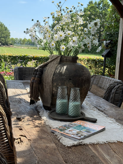 Kaars in bewerkt glas met mintgroene kaars – 23 x 10 cm.