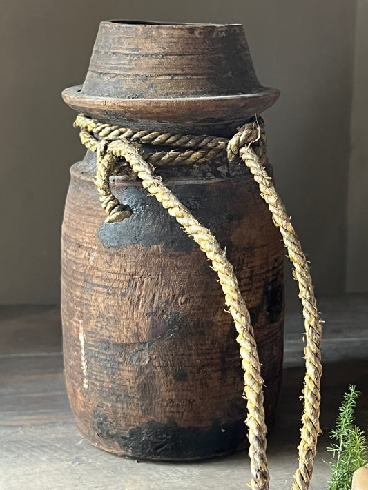 Old nepalese pot with rope