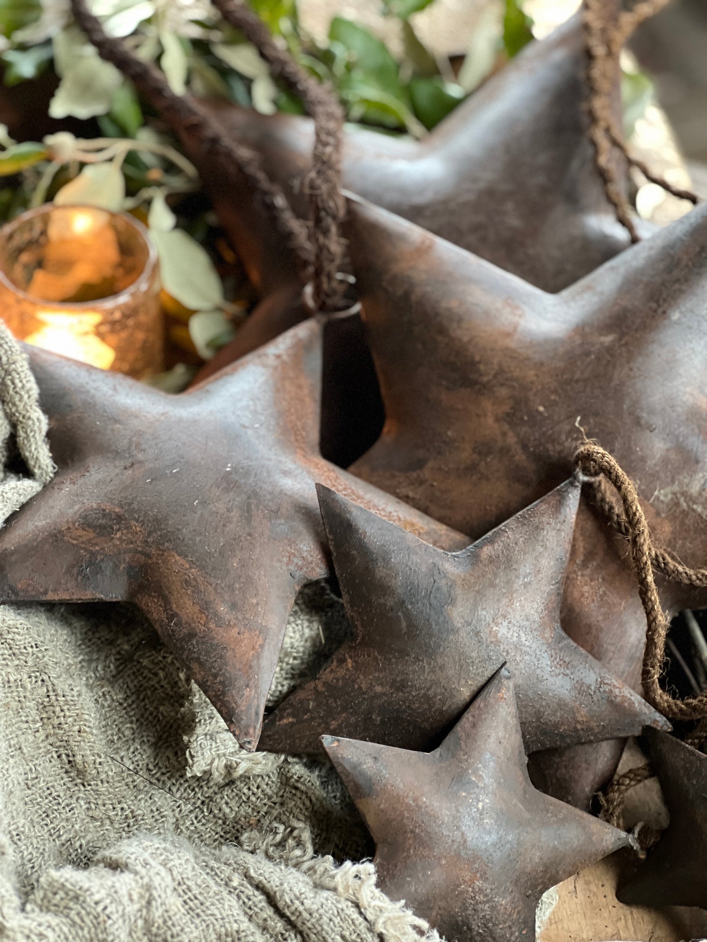 Rusted star with ribbon, available in various sizes