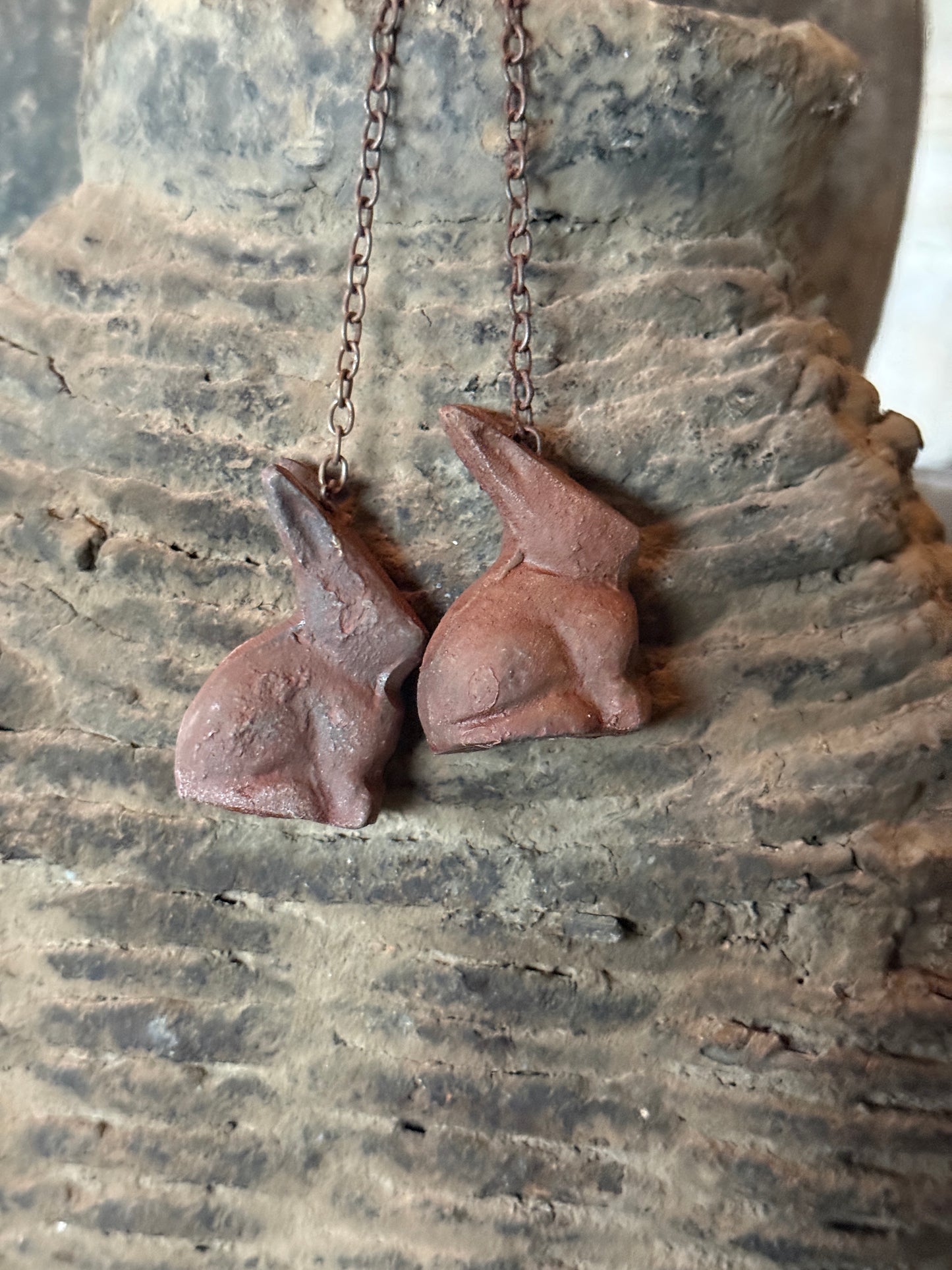 Metal hare on iron chain – rust color