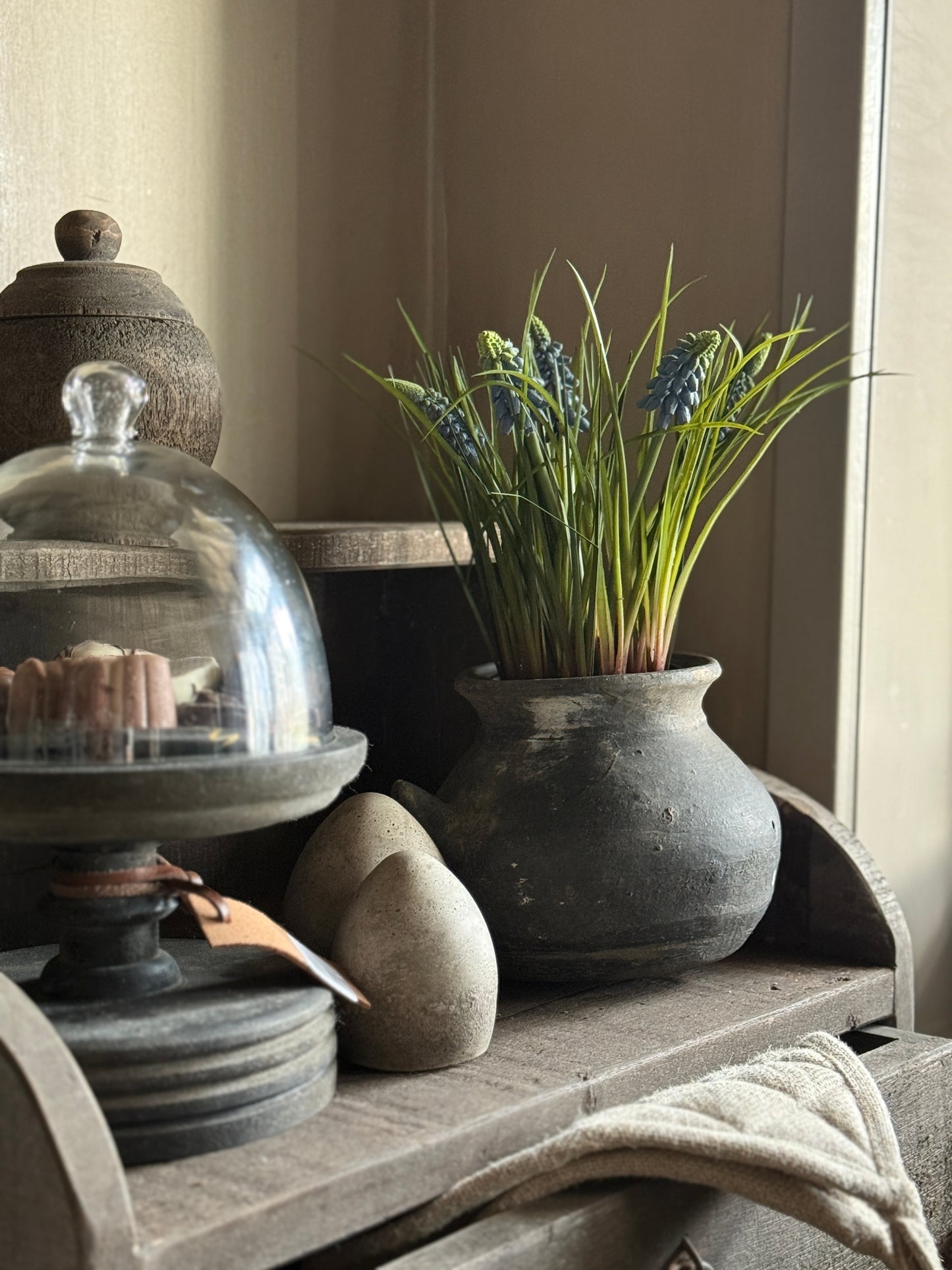 Art pot with blue grape hyacinths